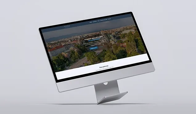 Landing page for a Sofia property project shown on an angled desktop monitor with city background and contact form
