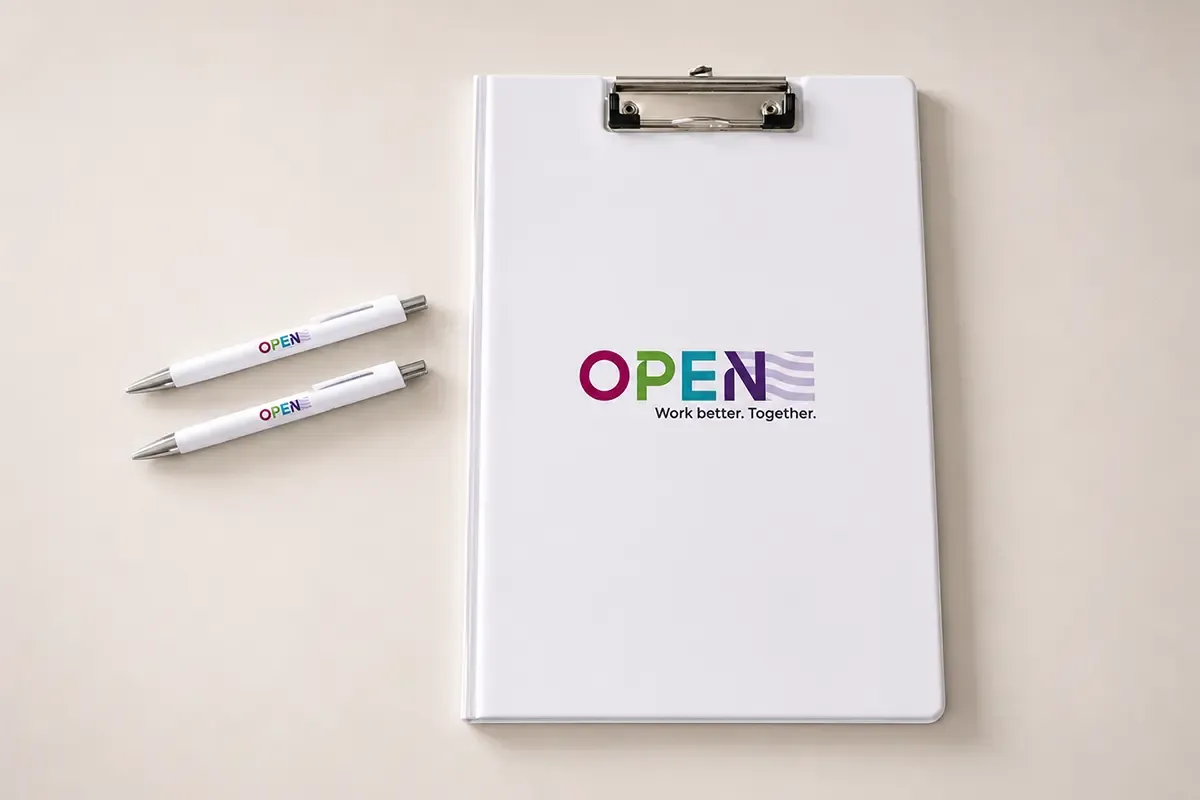 Clipboard and pens with the OPEN by TSA visual identity